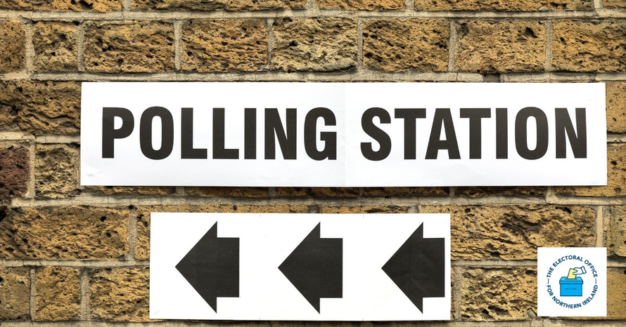 Polling station sign on a brick wall